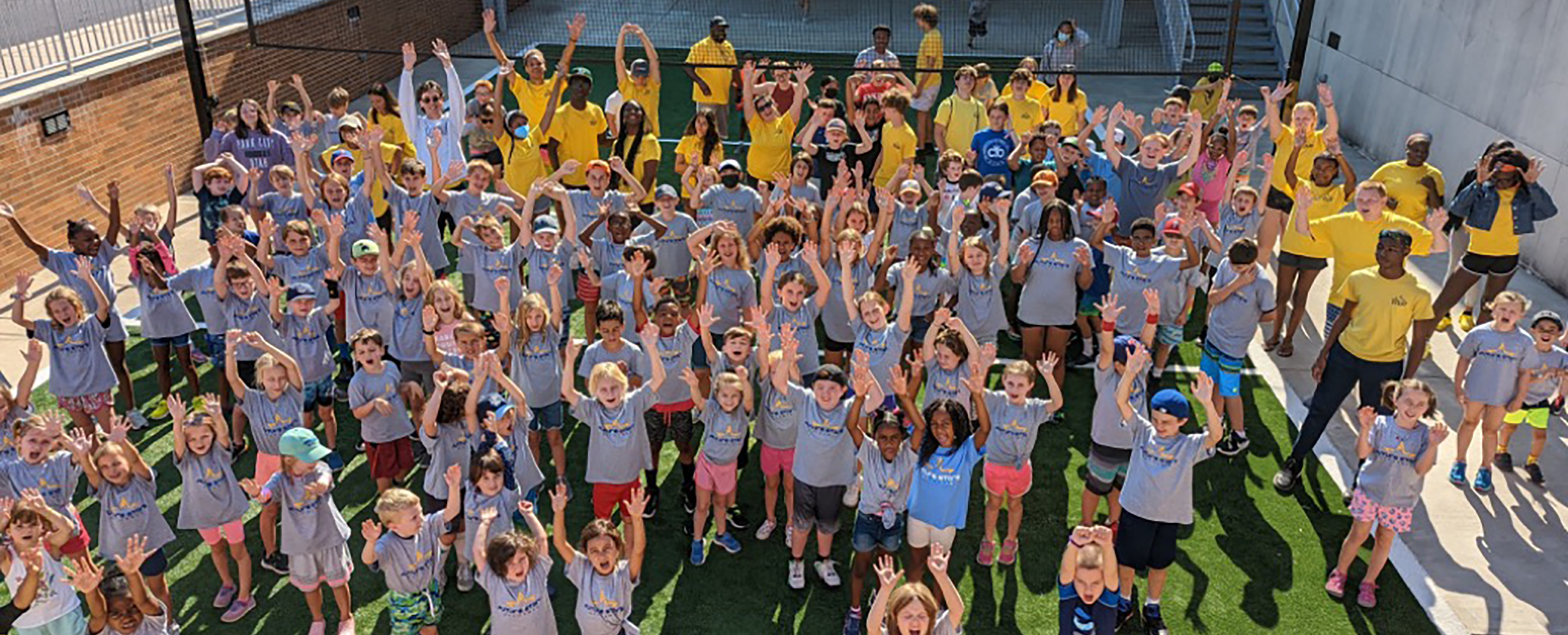 a group of young campers posing in the sun