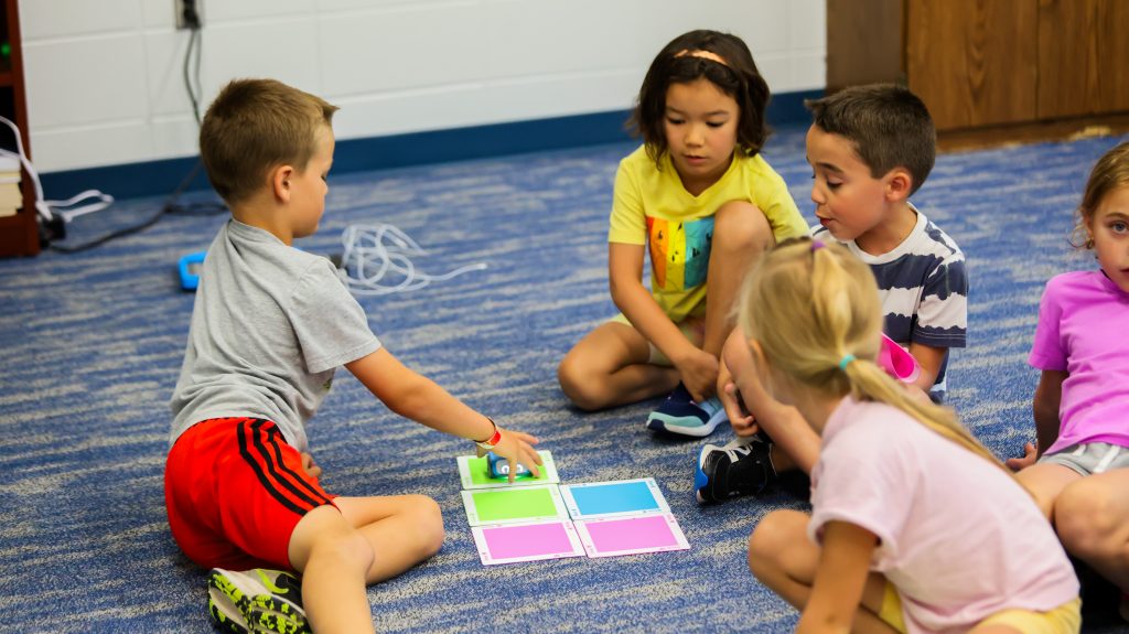 A group of young campers during one of the day camp programs participating in a group activity